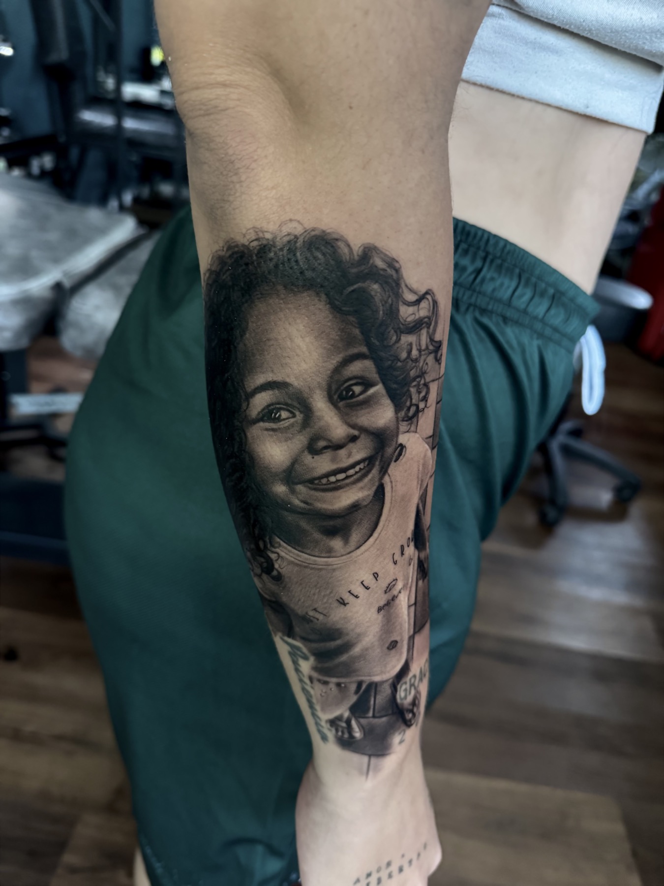 Realistic black and grey portrait tattoo by Mike Villamizar in Panama