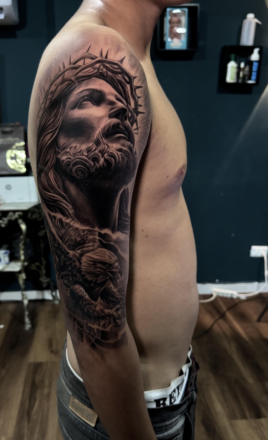 Religious black and grey realism tattoo by Mike Villamizar